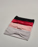 Rosa Stirnband aus Samt Stoff mit Klotendetail vorne. #1