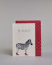 Karte in Englisch mit der Aufschrift „Be unique“ in schwarzer Schrift auf hellem Hintergrund. Darunter ist ein Zebra abgebildet, das auffällig rote High Heels trägt. Dazu ein rot-weißes handgeschöpftes Kuvert. #2