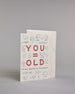 Glückwunschkarte auf Englisch zum Geburtstag mit roter Aufschrift "YOU=OLD if my math is correct", mit schwarzen mathematischen Zeichen Ziffern und Diagrammen rund um die mittig gesetzte Schrift auf hellem Hintergund. Aufgeteilt ist die Schrift wiefolgt: "YOU", darunter "=", darunter "OLD", darunter "if my math is correct". Dazu ein weißes handgeschöpftes Kuvert. #3