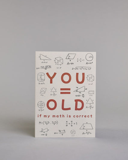 Glückwunschkarte auf Englisch zum Geburtstag mit roter Aufschrift "YOU=OLD if my math is correct", mit schwarzen mathematischen Zeichen Ziffern und Diagrammen rund um die mittig gesetzte Schrift auf hellem Hintergund. Aufgeteilt ist die Schrift wiefolgt: "YOU", darunter "=", darunter "OLD", darunter "if my math is correct". Dazu ein weißes handgeschöpftes Kuvert. #1