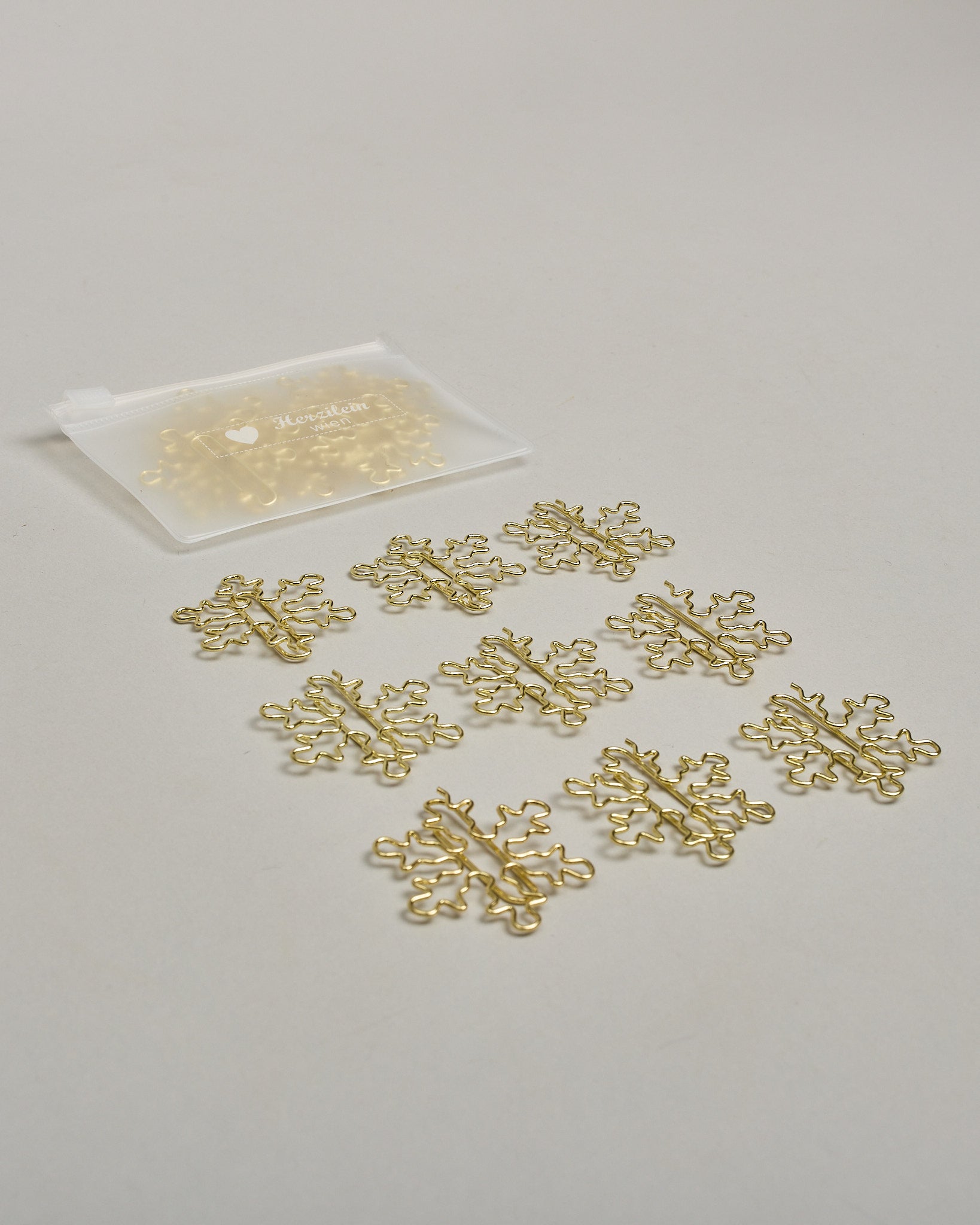 Büroklammern in Form von Schneeflocken aus goldenem Draht. Sie kommen in einer kleinen Silikonverpackung. #3