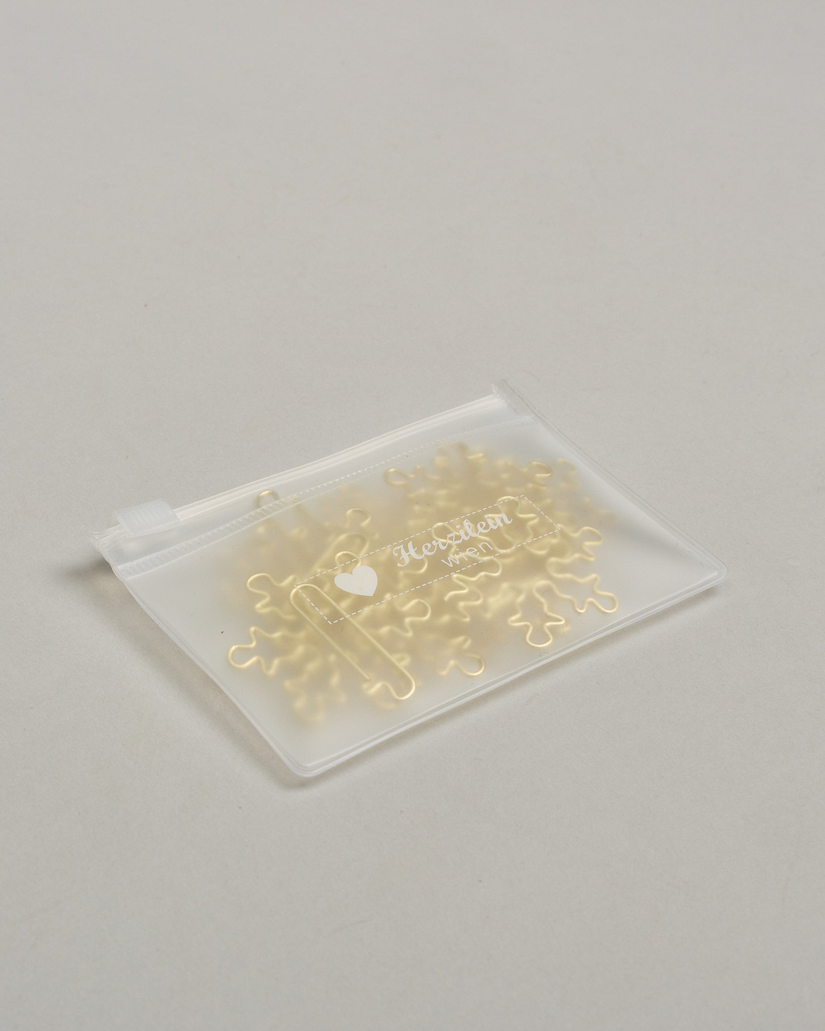 Büroklammern in Form von Schneeflocken aus goldenem Draht. Sie kommen in einer kleinen Silikonverpackung. #4