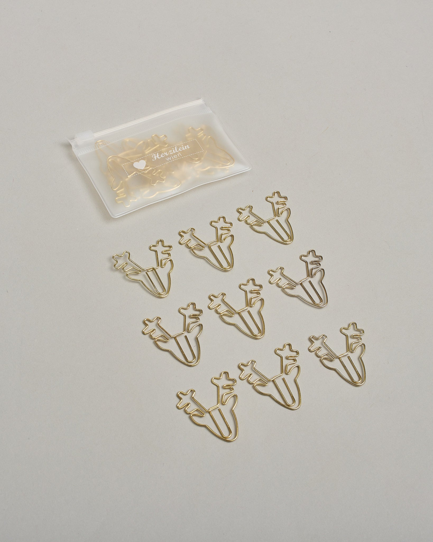 Büroklammern in Form von Rentieren aus goldenem Draht. Sie kommen in einer kleinen Silikonverpackung. #2