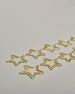 Zehn Büroklammern in Form von Sternen aus goldenem Draht. Sie kommen in einer kleinen Silikonverpackung. #1