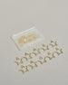 Zehn Büroklammern in Form von Sternen aus goldenem Draht. Sie kommen in einer kleinen Silikonverpackung. #2