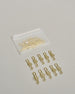 Zehn Büroklammern in Form von Notenschlüsseln aus goldenem Draht. Sie kommen in einer kleinen Silikonverpackung. #2