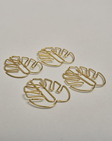 Büroklammern in Form von Monsterablättern aus goldenem Draht. Sie kommen in einer kleinen Silikonverpackung. #1